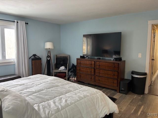 bedroom featuring wood finished floors