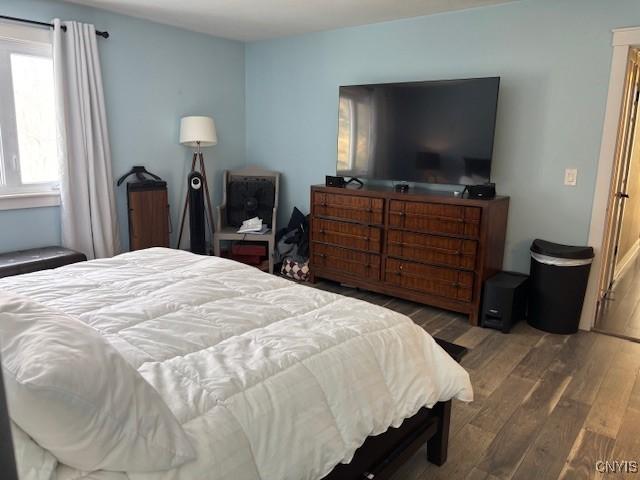 bedroom with wood finished floors