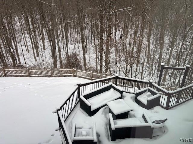 snow covered deck featuring an outdoor living space