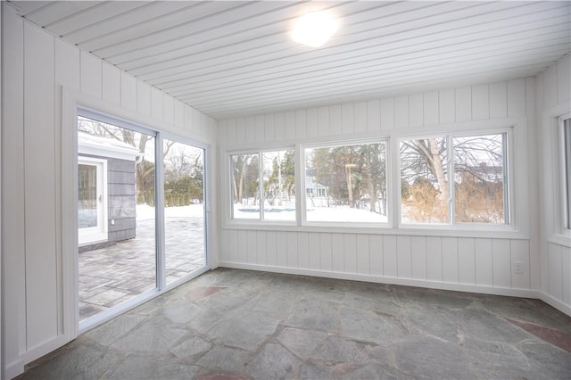 unfurnished sunroom featuring a wealth of natural light