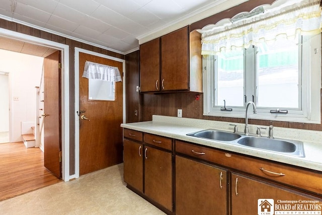 kitchen with light floors, light countertops, and a sink