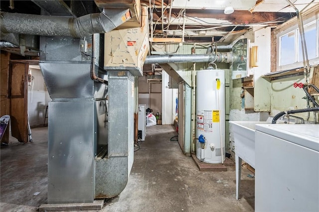 utility room featuring heating unit, washer / dryer, and water heater