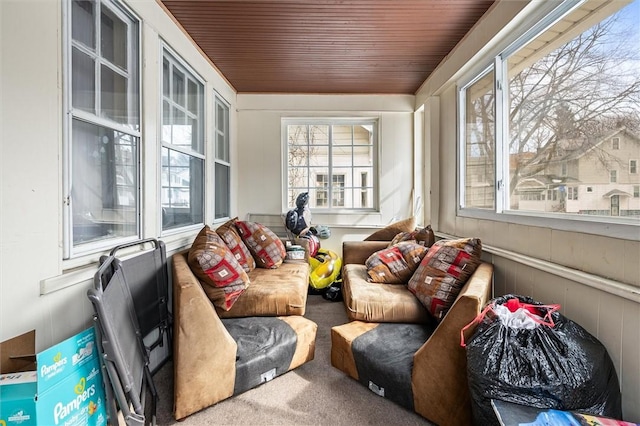 sunroom featuring wooden ceiling