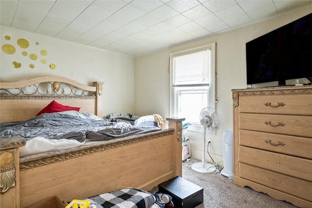 bedroom featuring light carpet