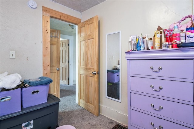 carpeted bedroom with a textured ceiling