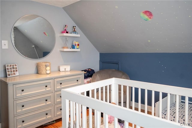 bedroom featuring vaulted ceiling