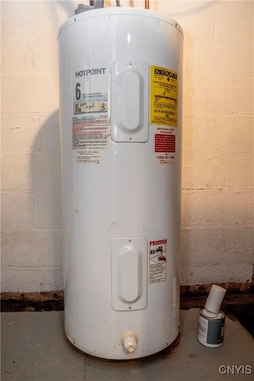 utility room with electric water heater