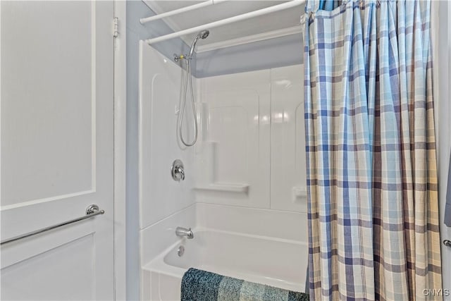 bathroom featuring shower / tub combo with curtain