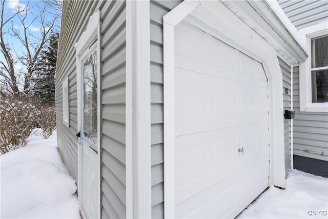 view of snow covered garage