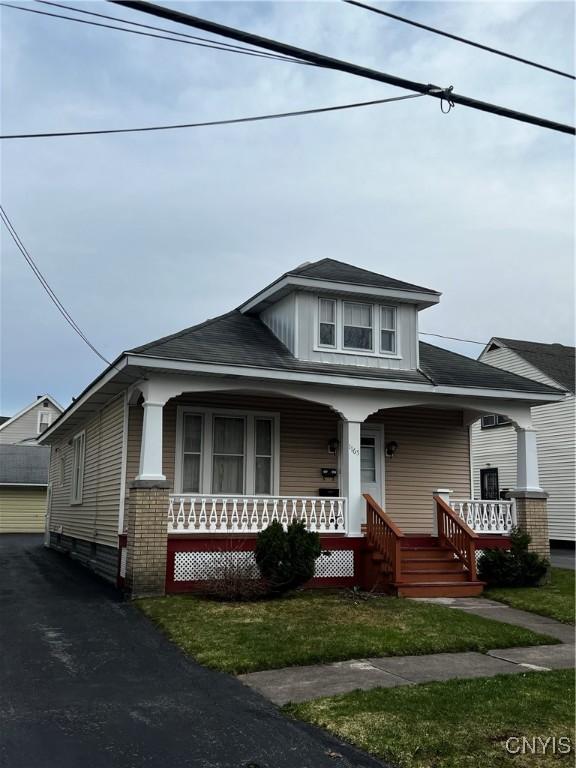 1165 Jefferson Ave, Utica, NY 13501 - view of front facade with a garage and a porch
