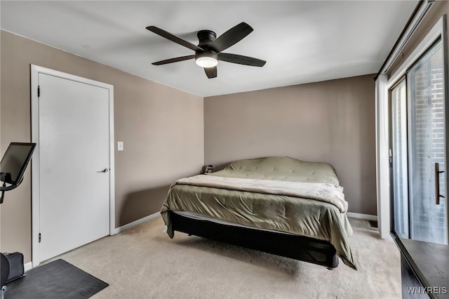 bedroom featuring baseboards, a ceiling fan, and light colored carpet