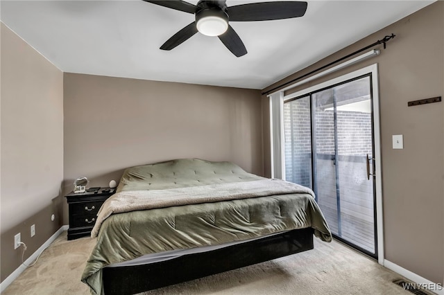 bedroom with access to exterior, light colored carpet, visible vents, ceiling fan, and baseboards