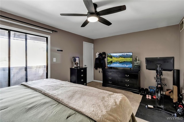 carpeted bedroom with access to outside, visible vents, and ceiling fan