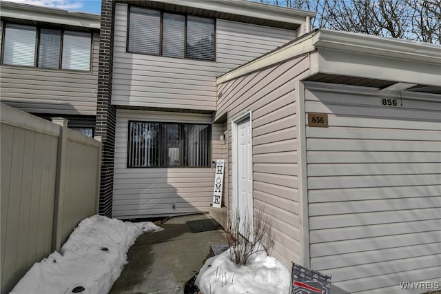 view of home's exterior featuring fence