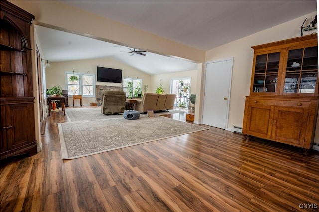 living area with ceiling fan, baseboard heating, vaulted ceiling, and dark wood finished floors