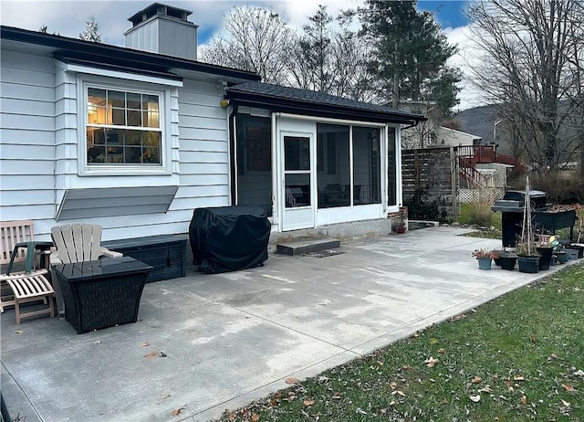 view of patio / terrace with a sunroom and area for grilling