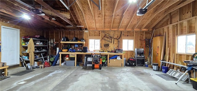 garage featuring a workshop area and a garage door opener