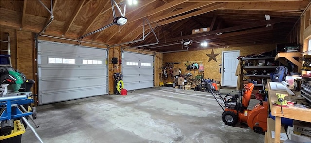 garage featuring a workshop area and a garage door opener