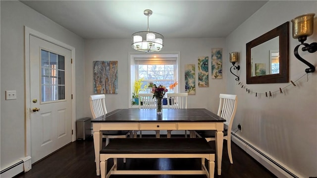 dining room with baseboard heating, dark wood finished floors, and a notable chandelier