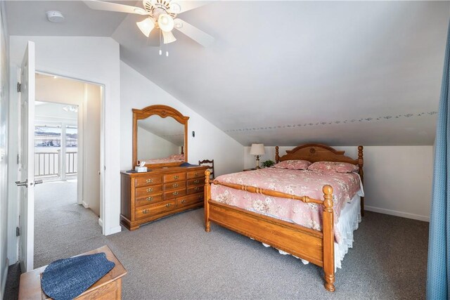 carpeted bedroom with a ceiling fan, vaulted ceiling, and baseboards