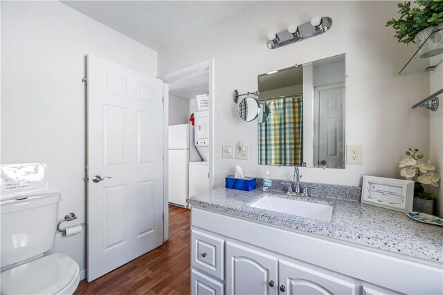 full bath with vanity, toilet, and wood finished floors