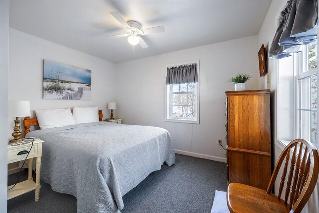 bedroom with carpet, a ceiling fan, and baseboards