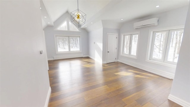 274 Reservoir Hill Rd, Plymouth, NY 13815 - unfurnished living room with a wall mounted air conditioner, hardwood / wood-style floors, lofted ceiling, a chandelier, and recessed lighting