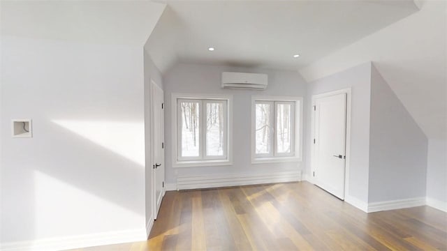 274 Reservoir Hill Rd, Plymouth, NY 13815 - bonus room featuring a wall mounted AC, vaulted ceiling, wood finished floors, and a baseboard heating unit