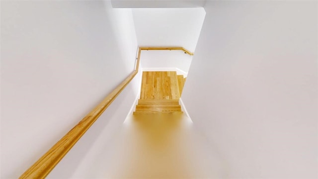274 Reservoir Hill Rd, Plymouth, NY 13815 - stairway with wood finished floors and baseboards
