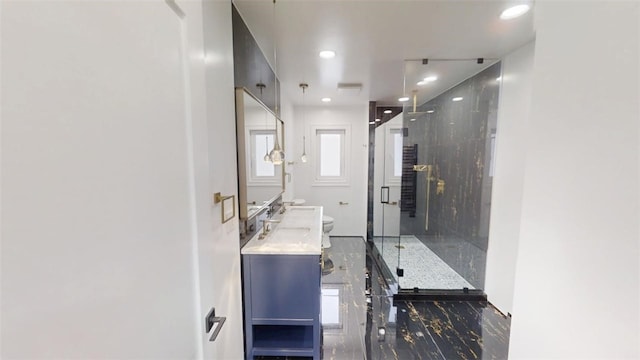 full bathroom with toilet, marble finish floor, a shower stall, and vanity