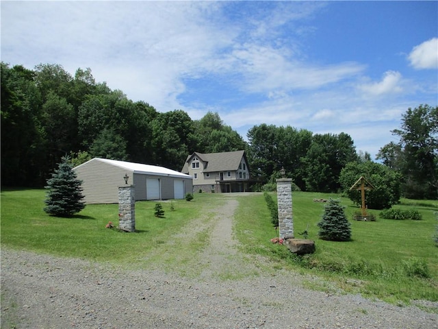 274 Reservoir Hill Rd, Plymouth, NY 13815 - view of front of house featuring driveway, a front lawn, a garage, and an outdoor structure