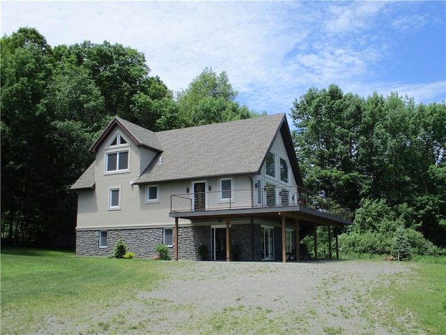274 Reservoir Hill Rd, Plymouth, NY 13815 - view of front of property with stone siding, a front yard, driveway, stucco siding, and a wooden deck