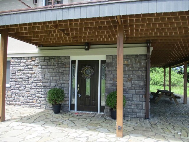 274 Reservoir Hill Rd, Plymouth, NY 13815 - property entrance with stone siding