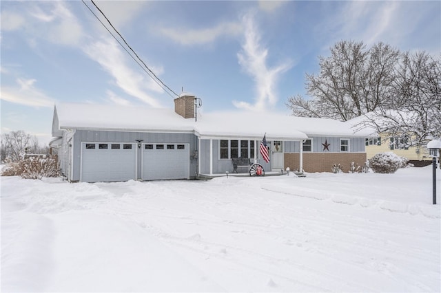 ranch-style home featuring board and batten siding, a chimney, and a garage