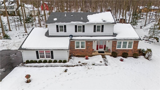 traditional home featuring brick siding