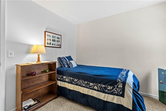 carpeted bedroom with baseboards