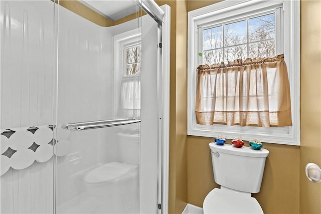 full bath with a shower with door and toilet