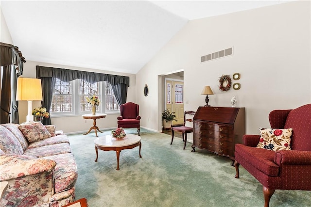 living room featuring carpet floors, high vaulted ceiling, visible vents, and baseboards