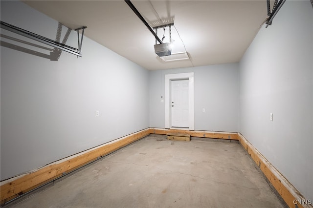 garage featuring baseboards and a garage door opener