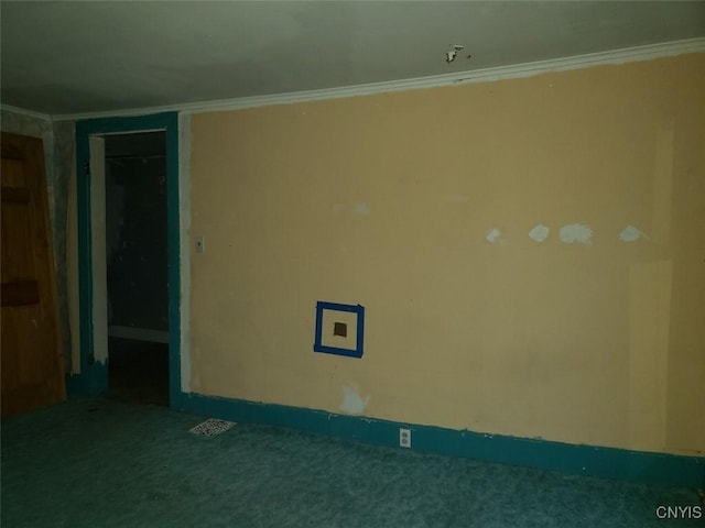 empty room with ornamental molding and carpet floors