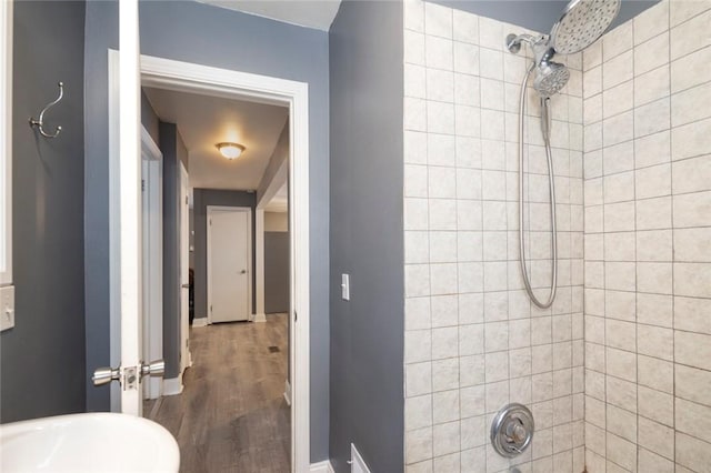 bathroom featuring baseboards and wood finished floors