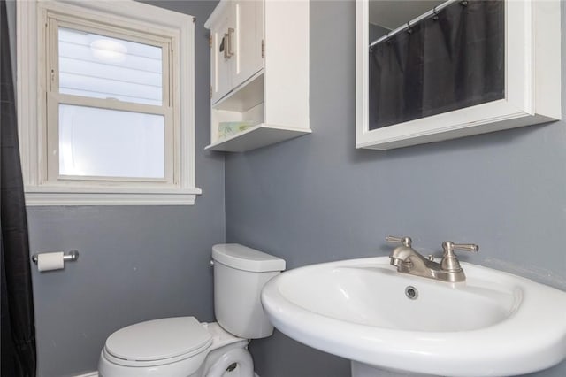 bathroom with a sink and toilet