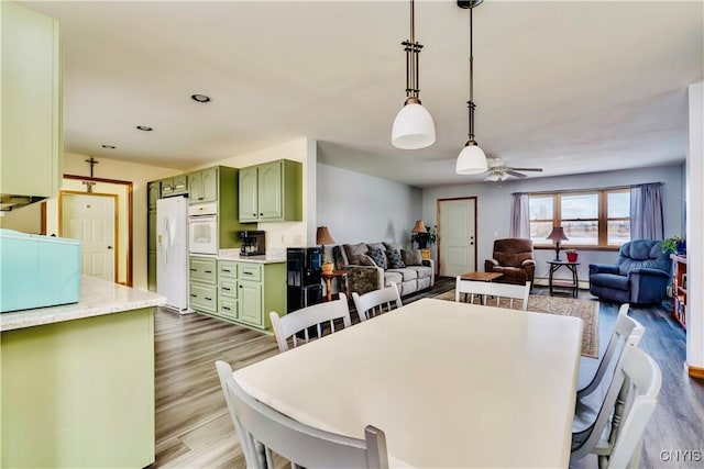 dining area featuring ceiling fan, wood finished floors, and recessed lighting