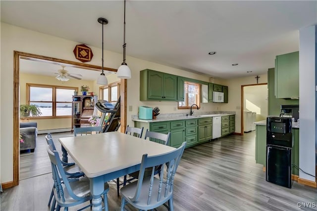 dining area with ceiling fan, recessed lighting, wood finished floors, baseboards, and baseboard heating