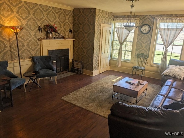 living area featuring baseboards, wood finished floors, a fireplace with flush hearth, and wallpapered walls