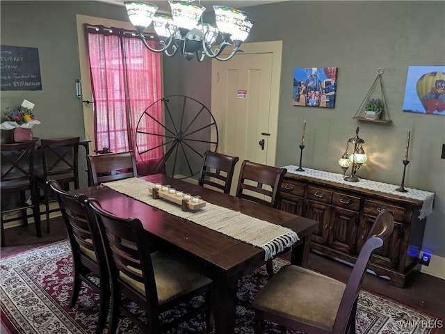 dining space featuring a notable chandelier