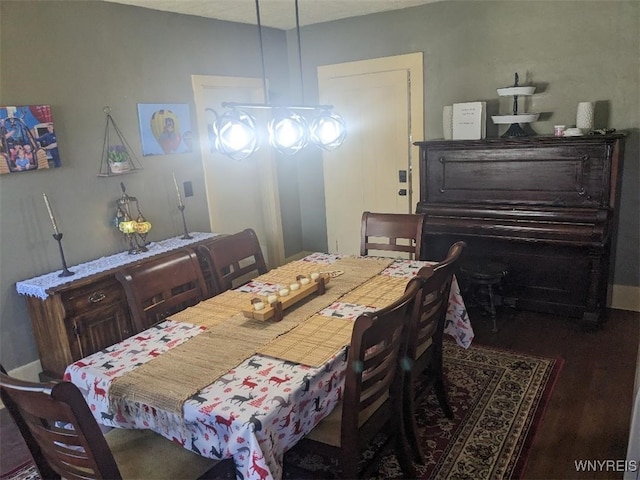 dining area with wood finished floors