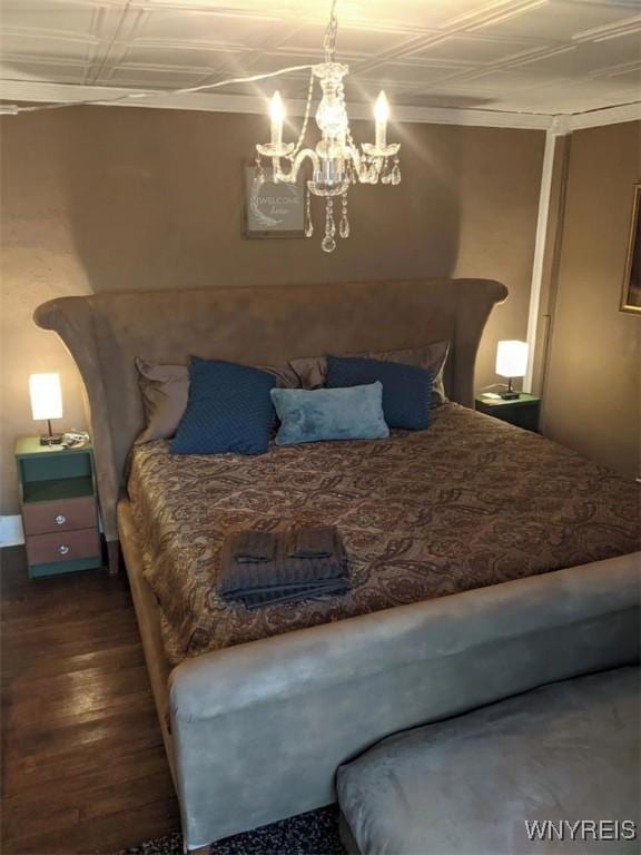 bedroom with an ornate ceiling and dark wood-type flooring