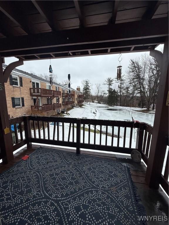 view of snow covered deck