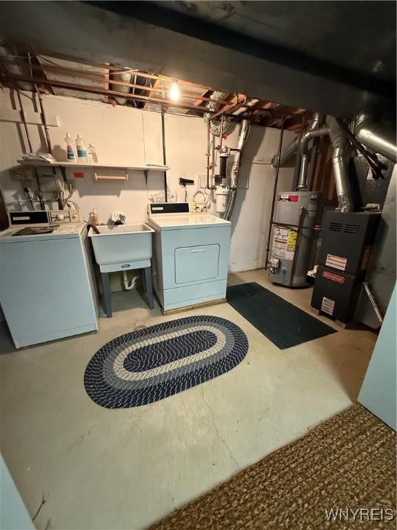 laundry room featuring laundry area, a sink, and gas water heater